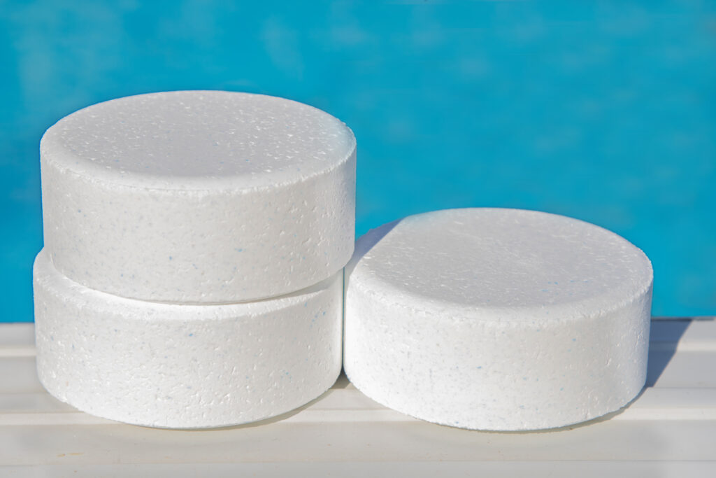 Chlorine tablets sitting outside of a pool