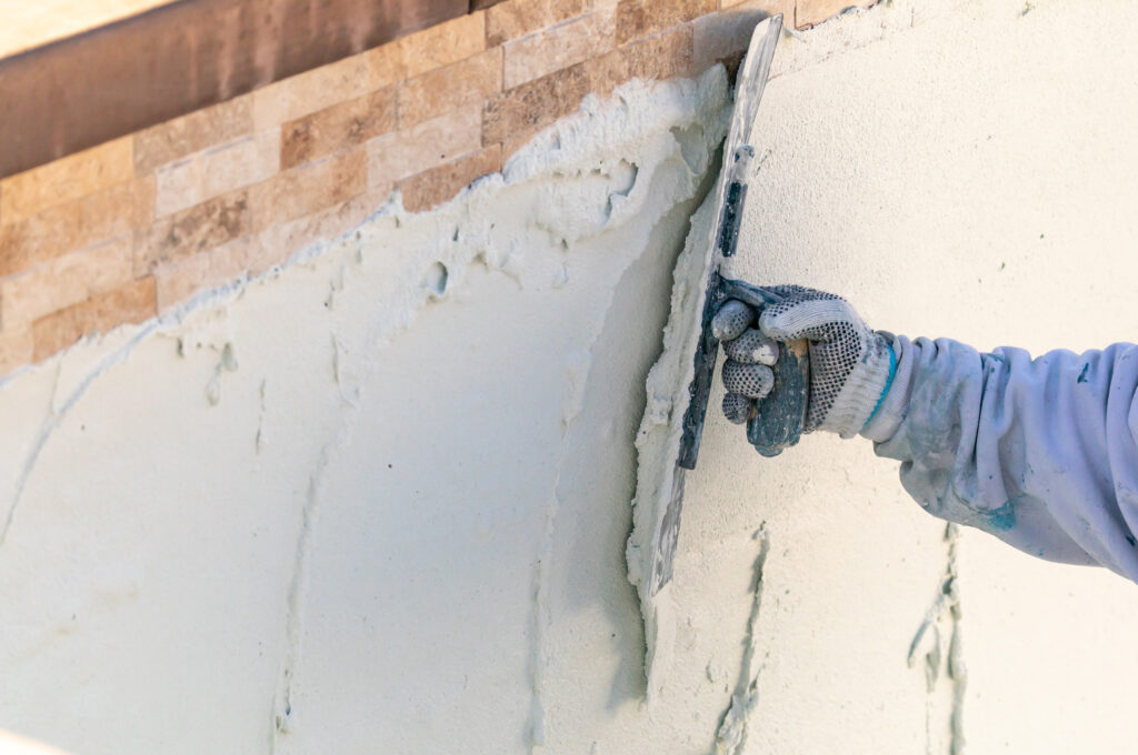 Mortar being added to a pool